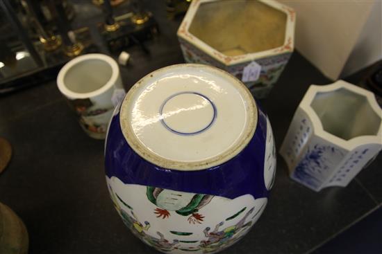 A pair of large Chinese famille verte powder blue ground jars and covers, late 19th century, 34.5cm, wood stands, one cover damaged,